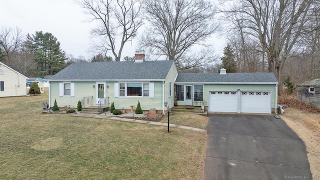 view of front facade featuring a front yard and a garage