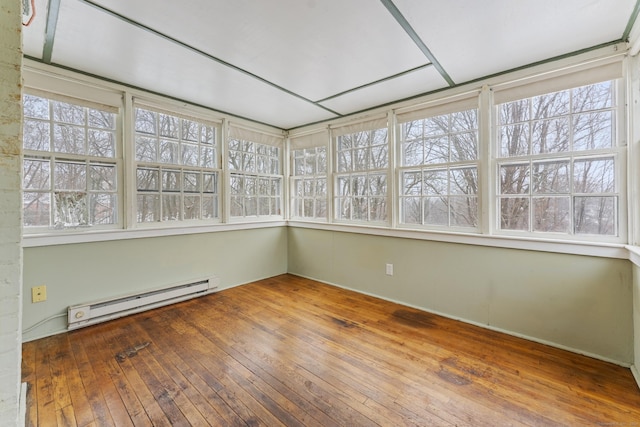 unfurnished sunroom featuring a baseboard radiator