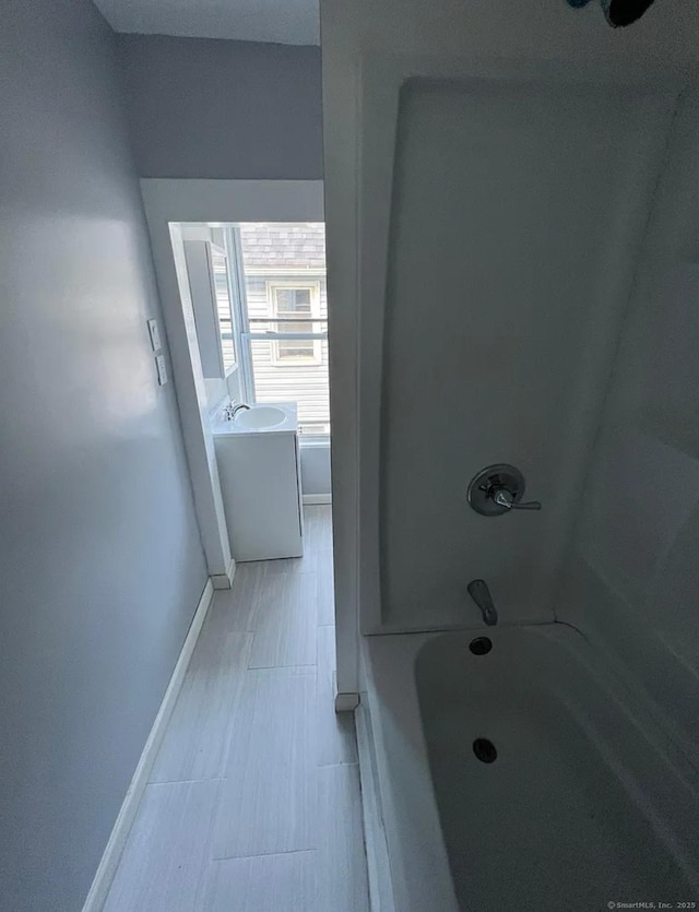 bathroom featuring vanity and bathtub / shower combination