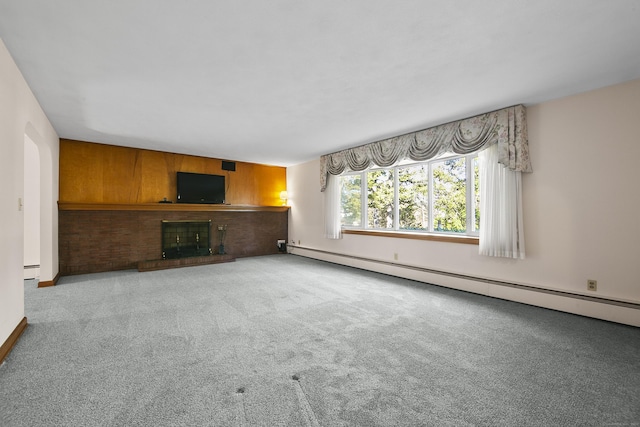 unfurnished living room featuring baseboard heating, light carpet, and a fireplace