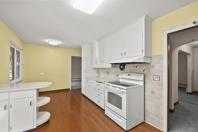 kitchen featuring white cabinets, white electric range, a baseboard radiator, and dark wood-type flooring