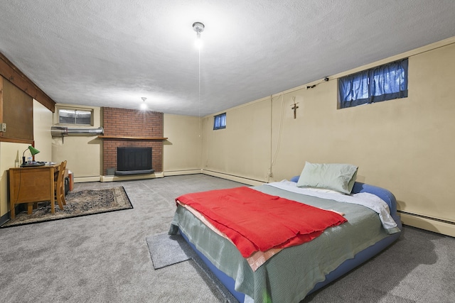 carpeted bedroom with a fireplace, a textured ceiling, and a baseboard radiator