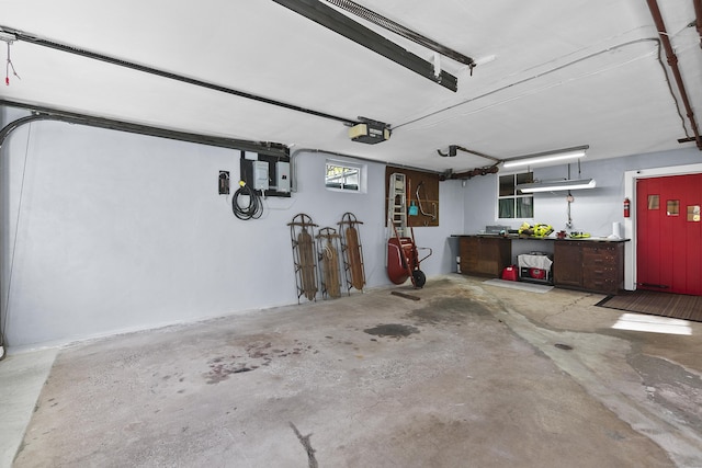 garage featuring a workshop area and a garage door opener