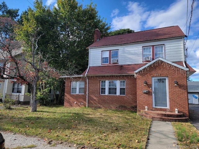 view of front of home with a front lawn