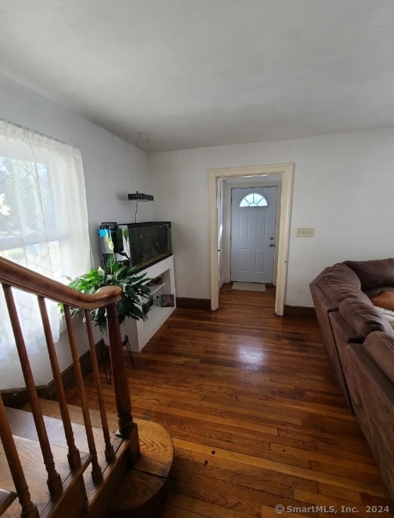 living room with dark wood-type flooring