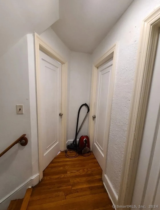 hallway featuring dark hardwood / wood-style flooring