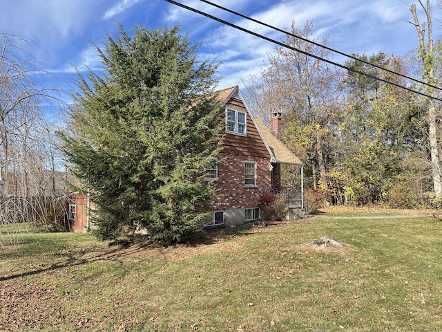 view of home's exterior with a yard