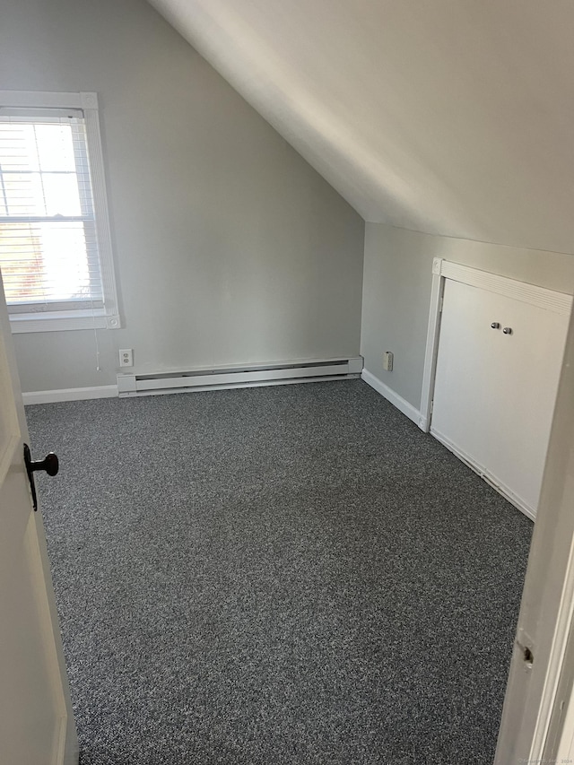 bonus room featuring carpet floors, baseboard heating, and lofted ceiling