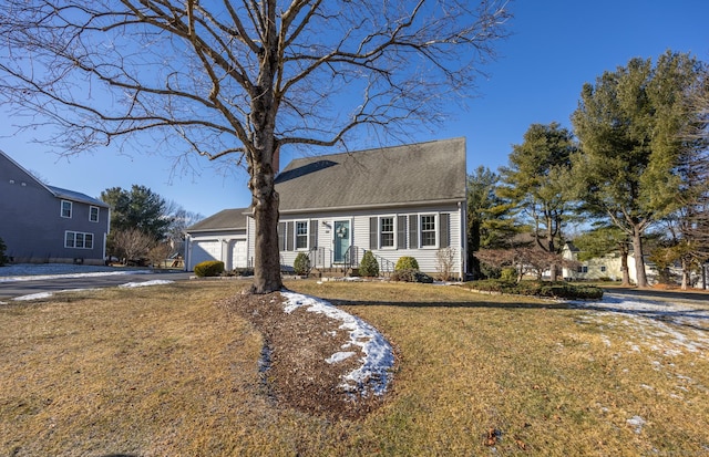 view of front of house with a front lawn and a garage