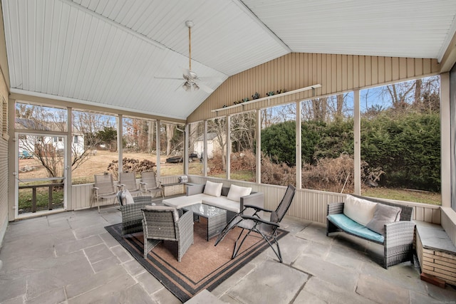 sunroom / solarium with ceiling fan and lofted ceiling