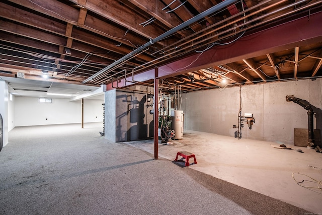 basement featuring carpet floors and water heater