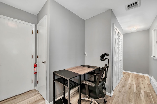 office space with light hardwood / wood-style flooring