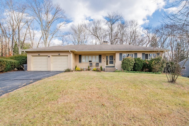 single story home with a porch, a garage, and a front lawn