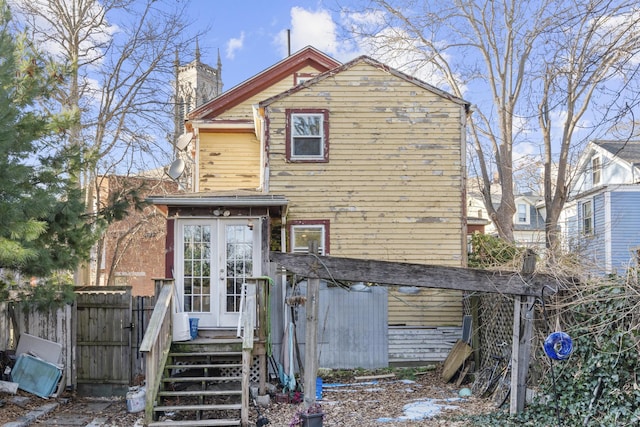 rear view of property featuring french doors