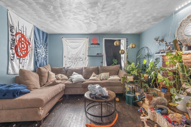 living room featuring a textured ceiling and dark hardwood / wood-style flooring