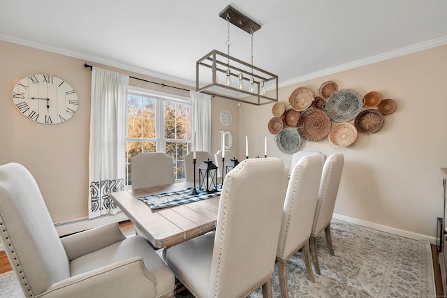 dining space featuring crown molding and light hardwood / wood-style floors