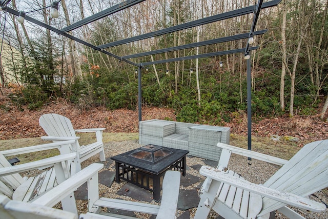 view of patio / terrace with a fire pit