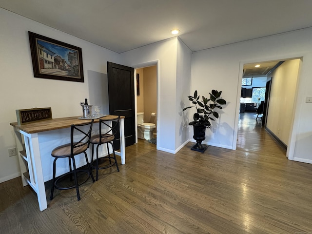 hall featuring dark wood-type flooring