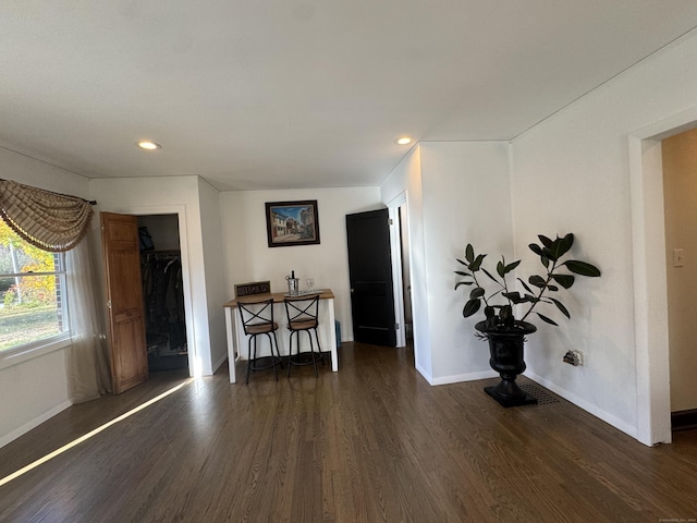 interior space with dark hardwood / wood-style flooring