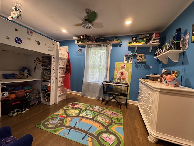 bedroom with crown molding and dark hardwood / wood-style flooring