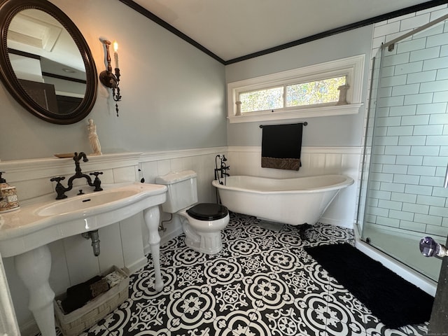 bathroom featuring tile patterned flooring, crown molding, shower with separate bathtub, and toilet