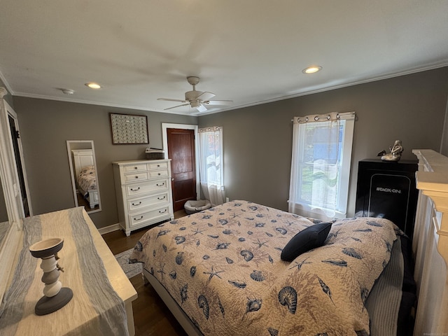 bedroom featuring dark hardwood / wood-style flooring, ornamental molding, and ceiling fan