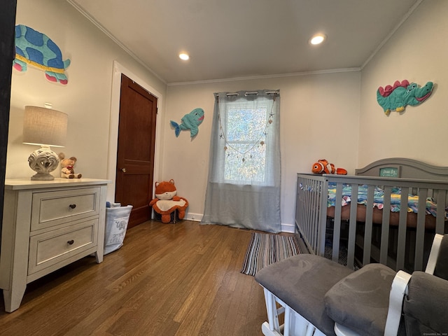 bedroom with dark wood-type flooring and ornamental molding