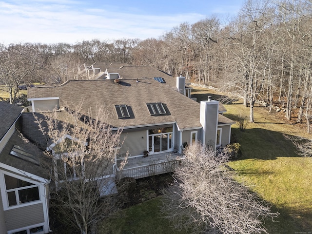 view of home's exterior featuring a yard and a deck