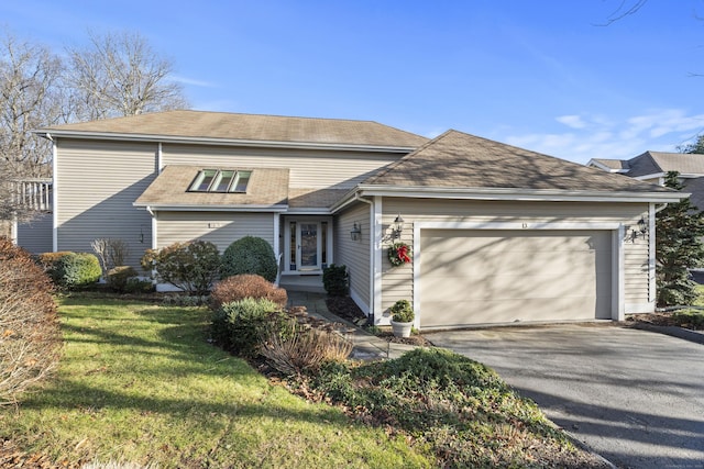 view of front of home featuring a garage and a front yard