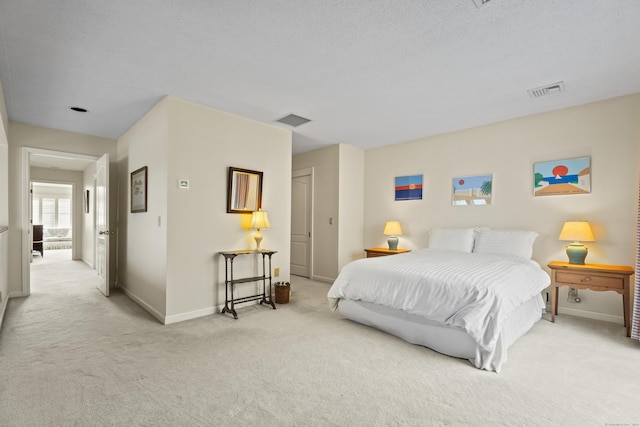 bedroom with light colored carpet and a closet