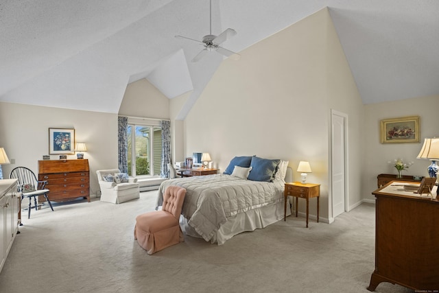 carpeted bedroom featuring vaulted ceiling and ceiling fan