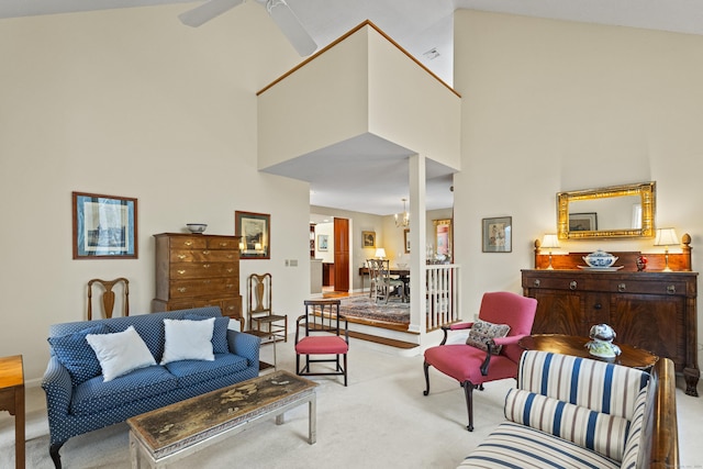 living room with ceiling fan, light carpet, and high vaulted ceiling