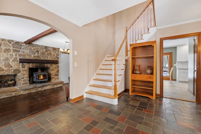 staircase with ornamental molding and beam ceiling