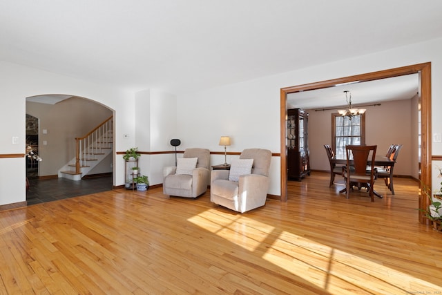 sitting room featuring light hardwood / wood-style flooring and a notable chandelier