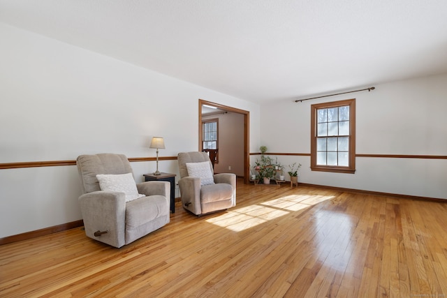 living area with light hardwood / wood-style floors