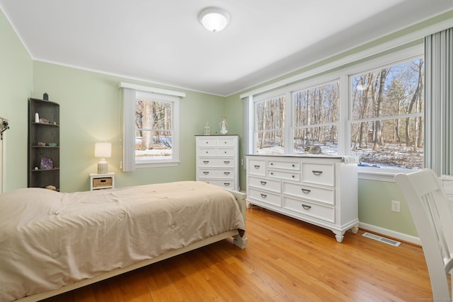 bedroom with light wood-type flooring