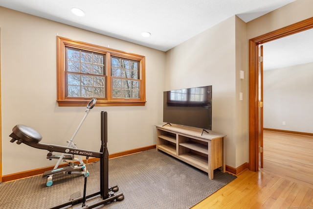 exercise room featuring light hardwood / wood-style flooring