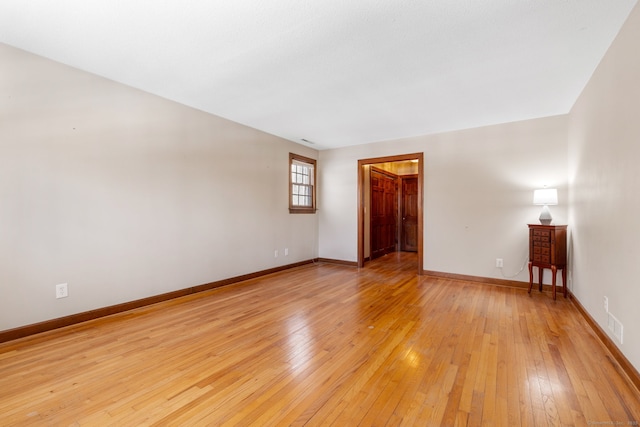 unfurnished room with light hardwood / wood-style flooring