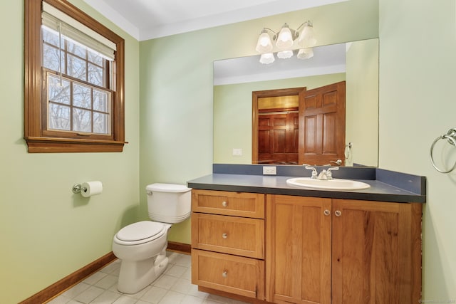 bathroom featuring vanity, tile patterned floors, and toilet