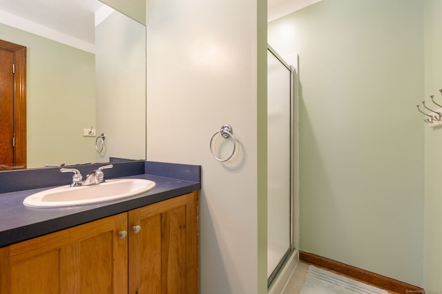 bathroom with vanity and an enclosed shower