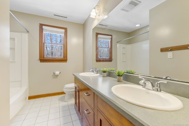 full bathroom featuring vanity, tile patterned flooring, toilet, and a healthy amount of sunlight