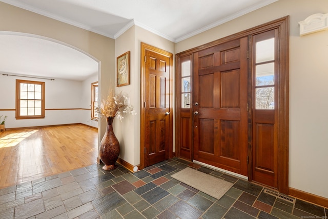 entryway featuring crown molding and dark hardwood / wood-style flooring