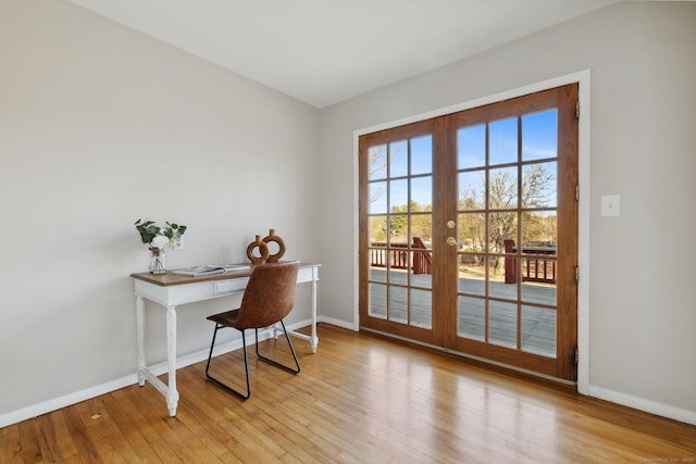 office area featuring french doors, light wood-type flooring, and baseboards