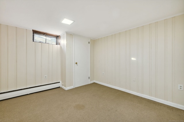 below grade area with a baseboard heating unit and carpet floors