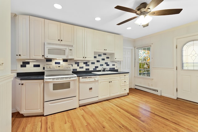 kitchen with light hardwood / wood-style flooring, a baseboard radiator, white appliances, and sink