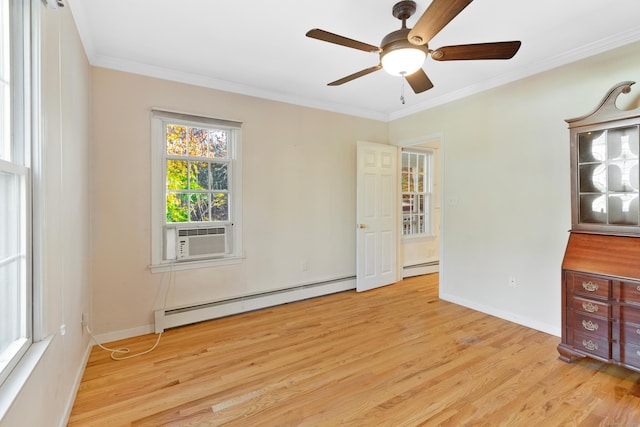 spare room featuring light wood-type flooring, a baseboard radiator, cooling unit, and crown molding