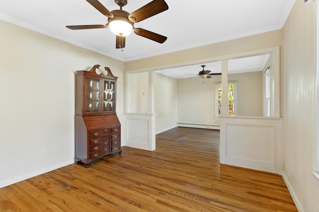 unfurnished dining area with crown molding, hardwood / wood-style floors, ceiling fan, and a baseboard radiator