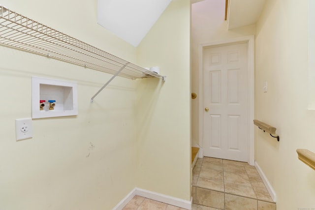 laundry room featuring light tile patterned flooring, washer hookup, and hookup for an electric dryer