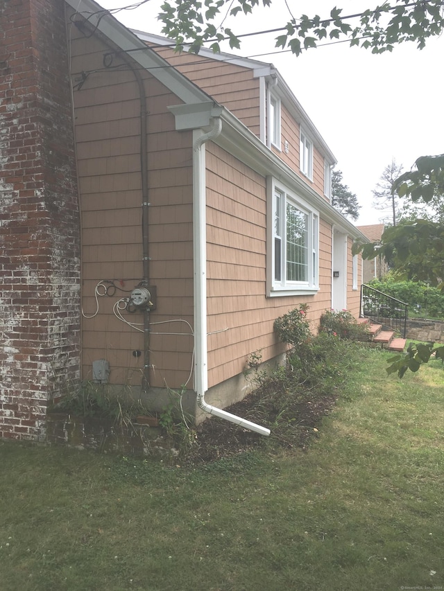 86 Vanguard St, Bridgeport, CT 06606 - view of side of home with a lawn