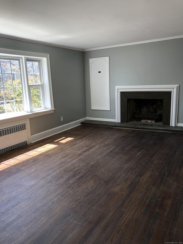 86 Vanguard St, Bridgeport, CT 06606 - unfurnished living room featuring radiator, dark wood finished floors, ornamental molding, and a fireplace